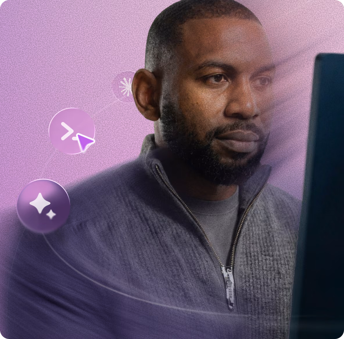 Man working at a computer with AI sparkle icons around him