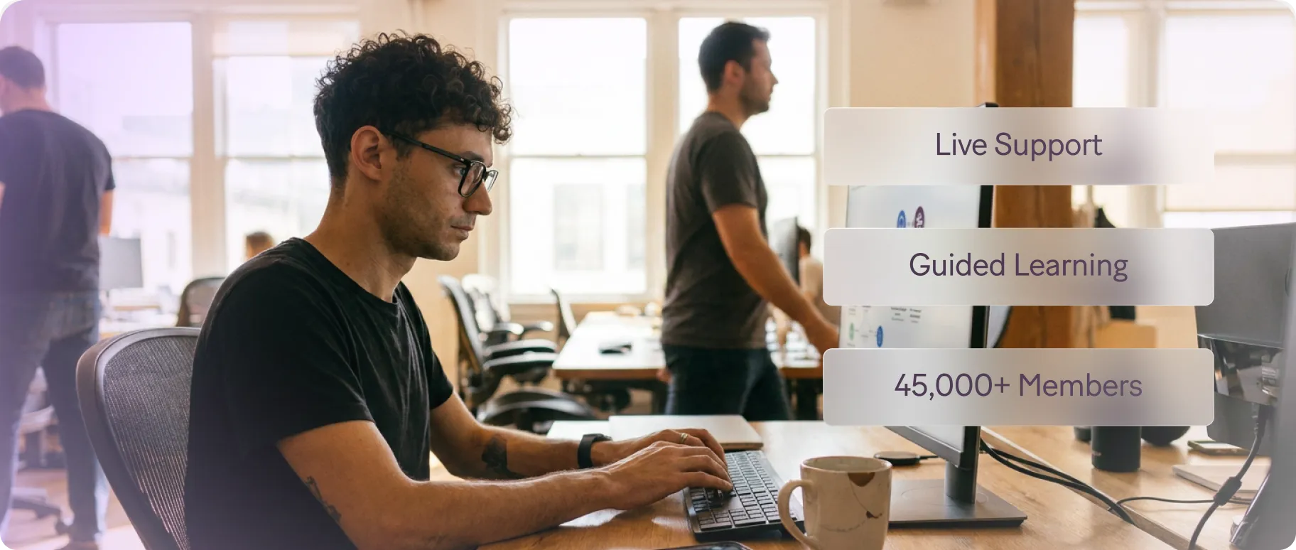 Developers working at laptops with support and community resources