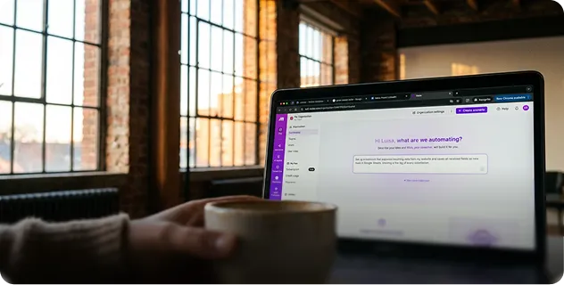 Laptop showing a Make workflow in a bright office