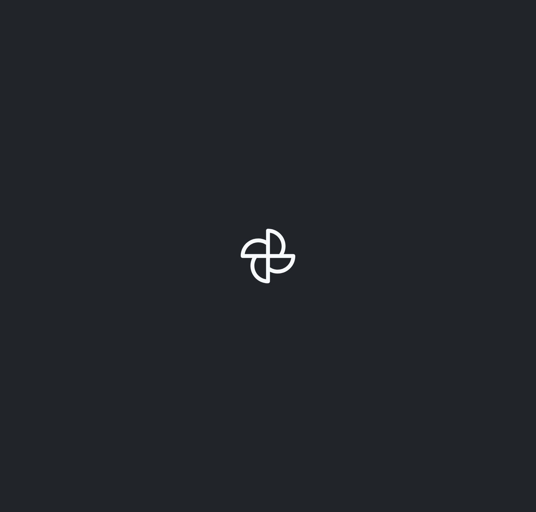 White abstract four-petal flower icon centered on dark gray background.