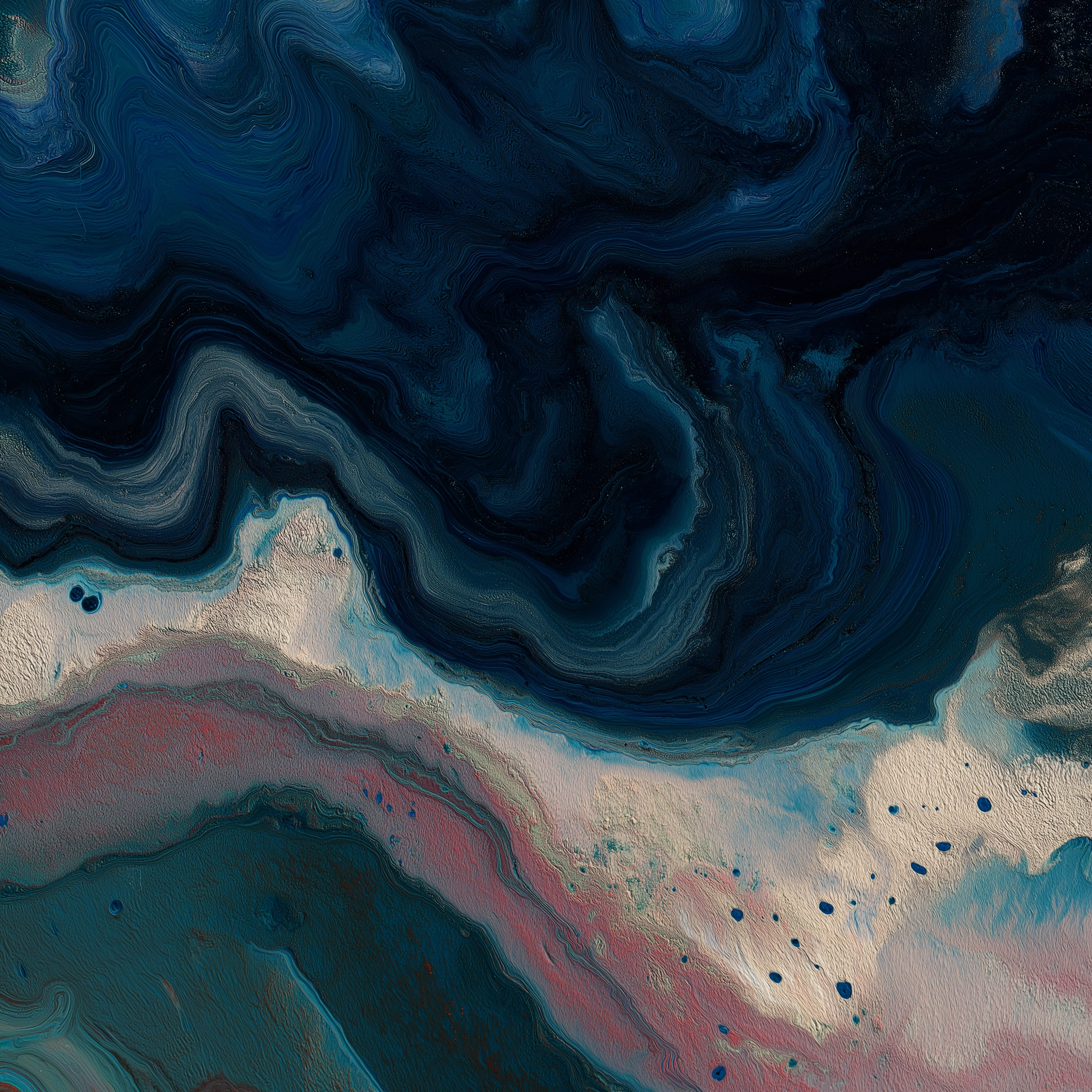 Abstract swirling patterns in dark blues, light blues, creams, and hints of pink and red.