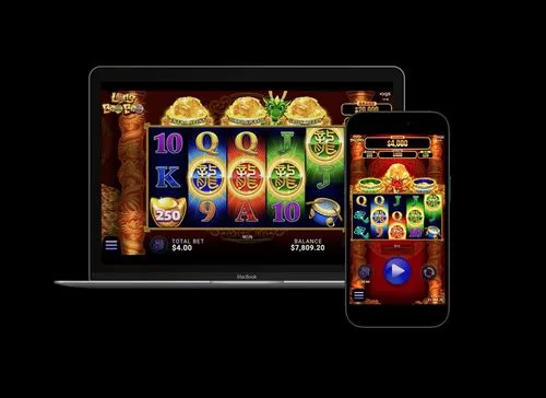 AGS dragon-themed slot machine game displayed on MacBook and iPhone