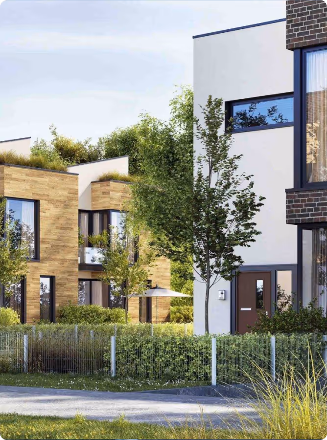 Moderne Wohnhäuser mit Holz- und Klinkerfassaden in grüner Umgebung