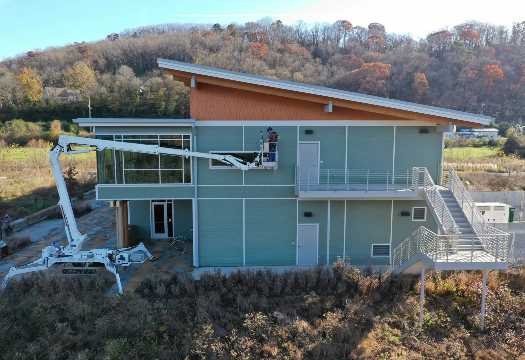 Facility maintenance with 90 ft tracked lift
