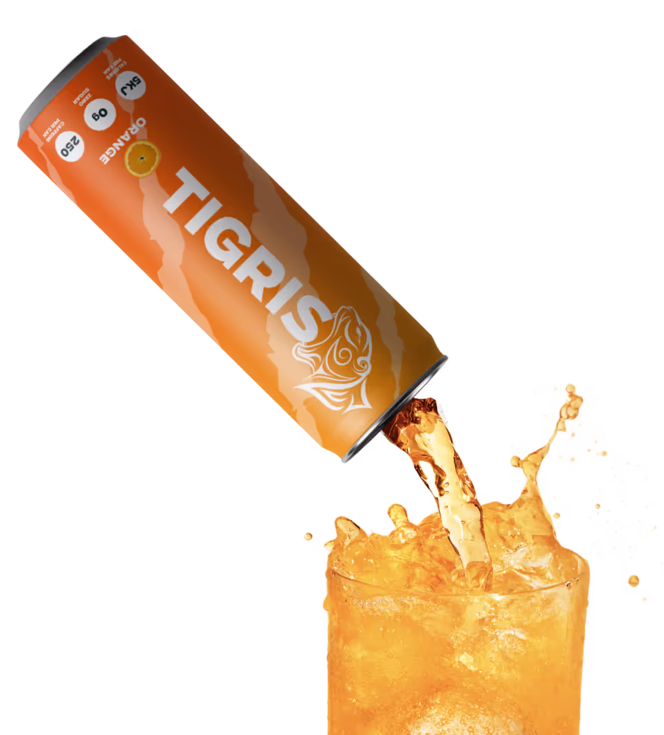 A can of Tigeris is being poured into a glass.
