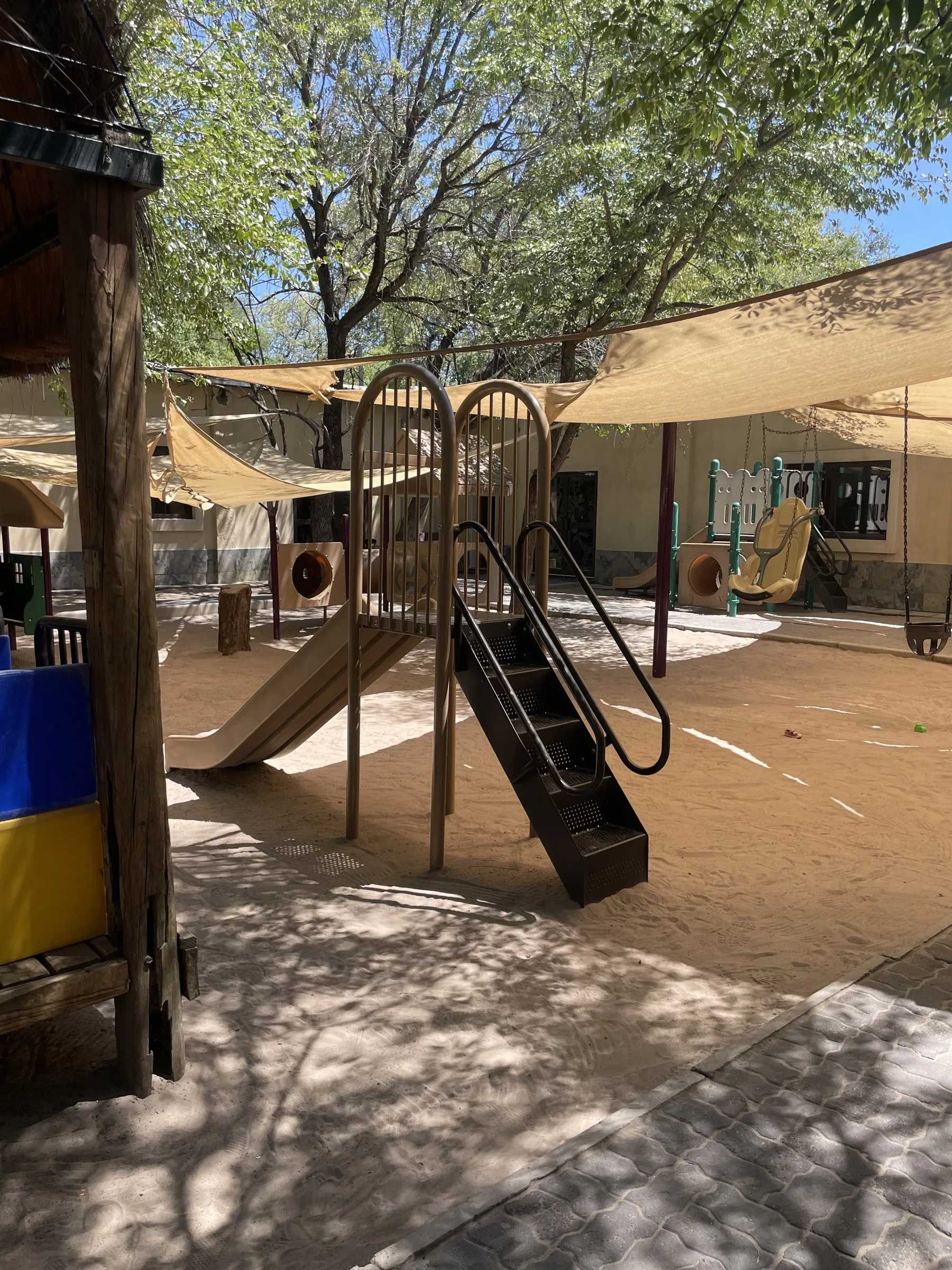 The slide and shaded play area at Lorato House