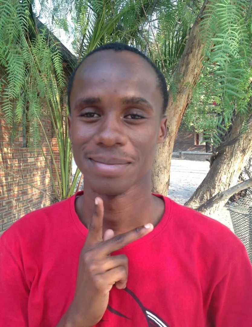 A Deaf Heart participant signing outdoors