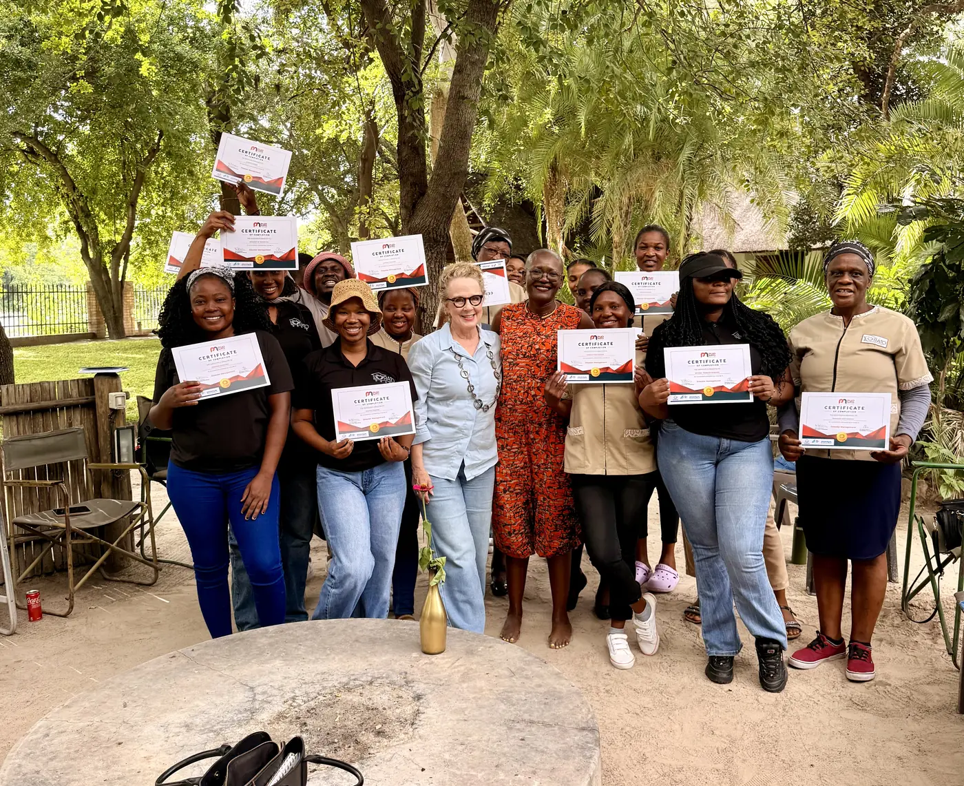 Lorato House caregivers holding their training certificates