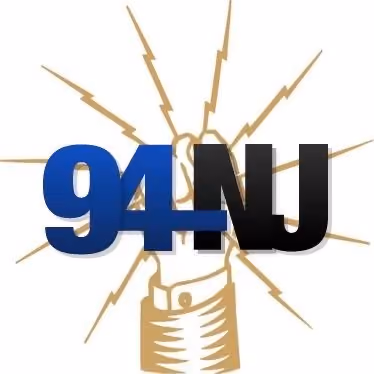 Logo with stylized fist and lightning bolts behind bold blue and black text reading '94NU'.