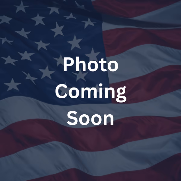 American flag with the text 'Photo Coming Soon' overlaid.