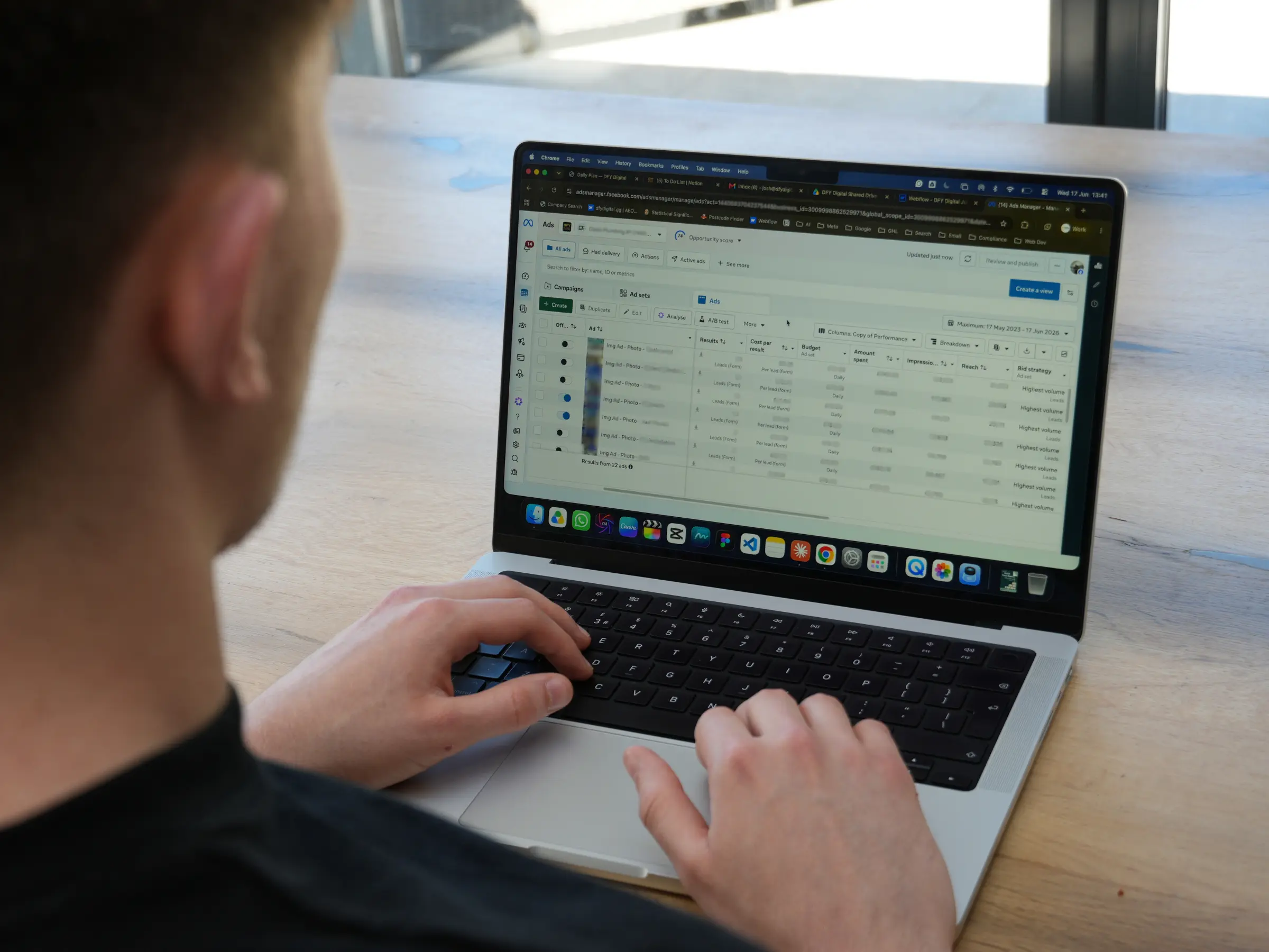 Josh sat looking at a laptop which shows the Meta ads dashboard
