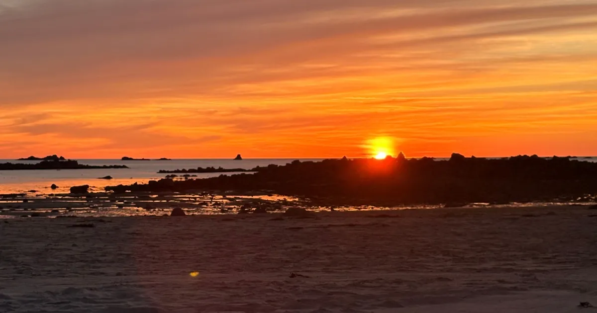 Les Amarreurs beach at sunset