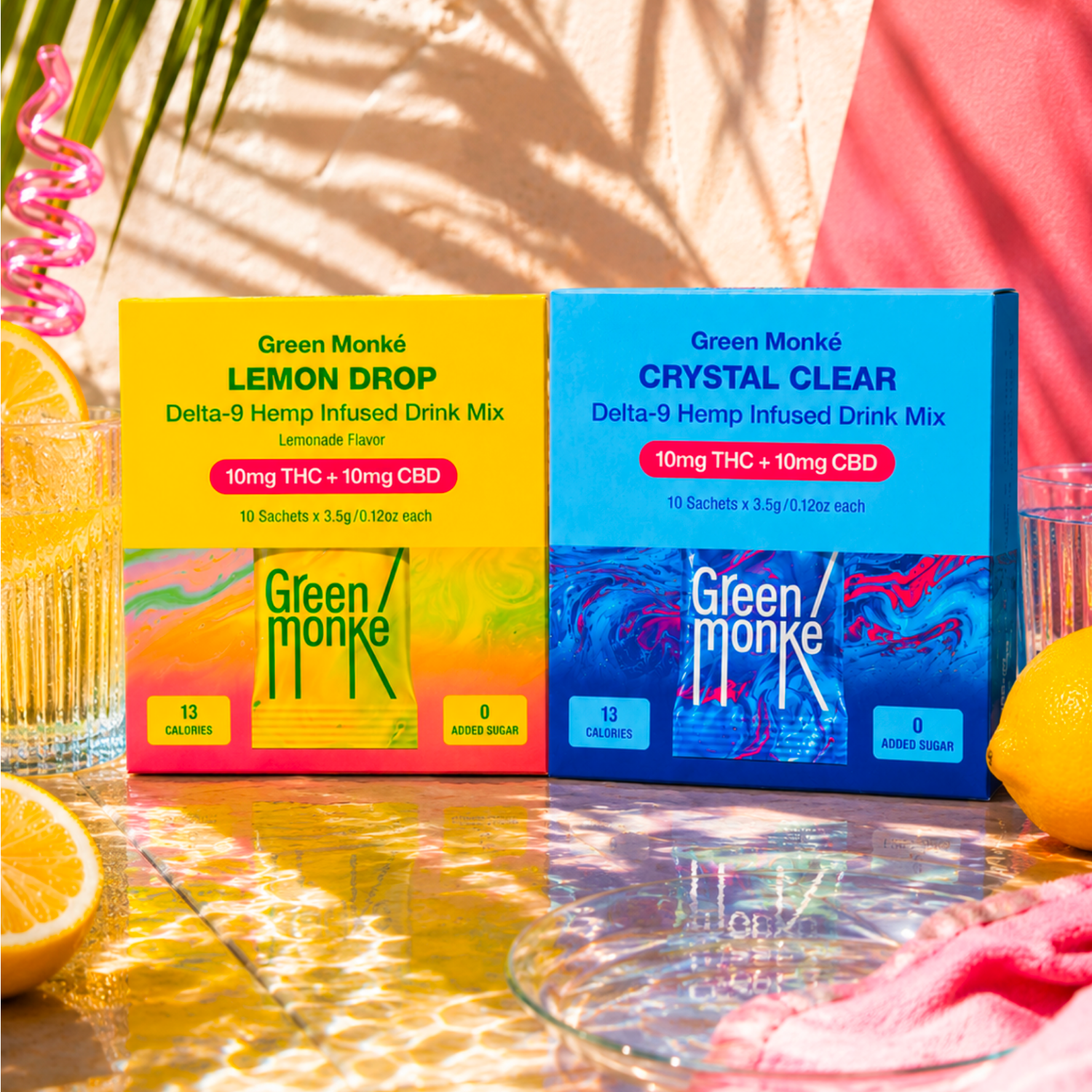 Green Monké Lemon Drop and Crystal Clear Mix Sticks boxes in bright poolside light