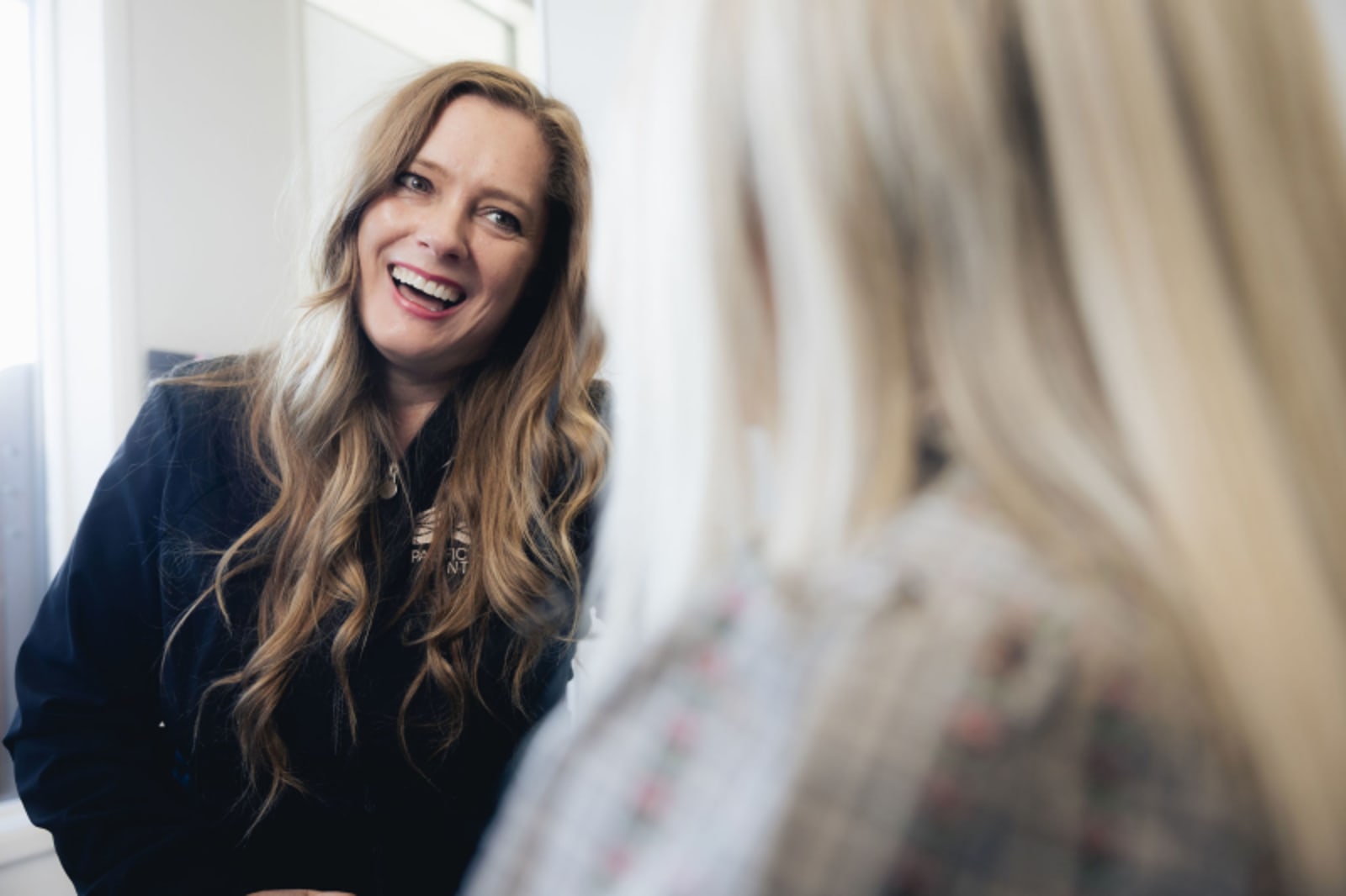 Female dentist smiling confidently in professional portrait at practice
