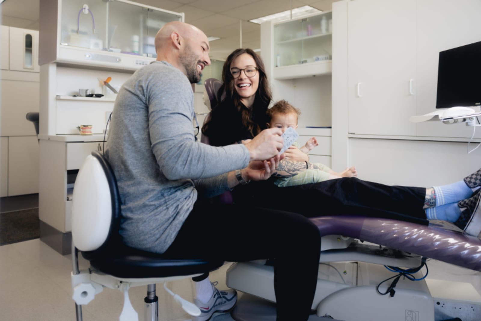 Dentist explaining treatment plan to patient in operatory