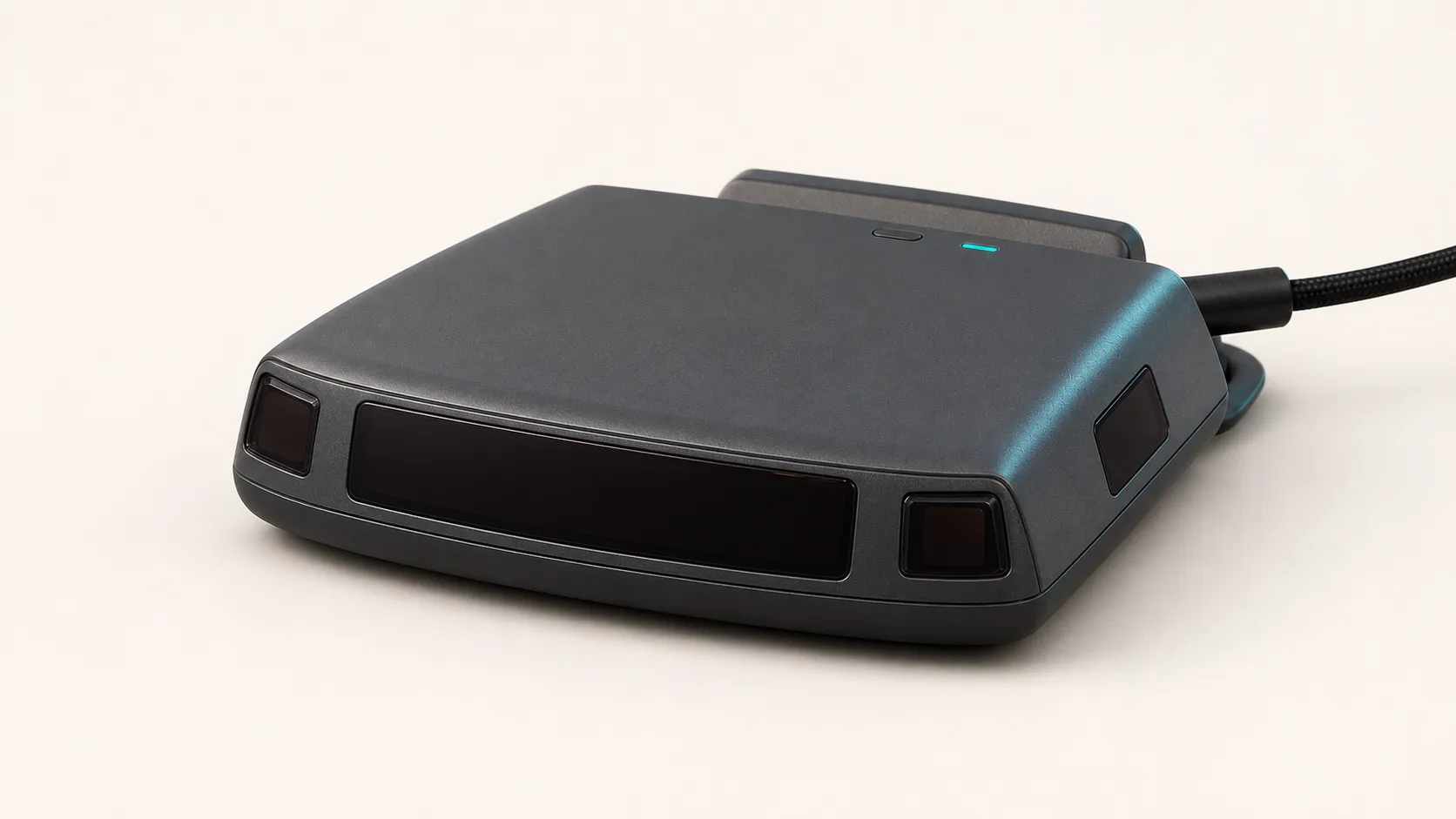 Close render of the BanditKin Sentinel showing the central road-facing panel, four smoked optical receiver windows, top status light, mounting cradle, and USB-C connection.