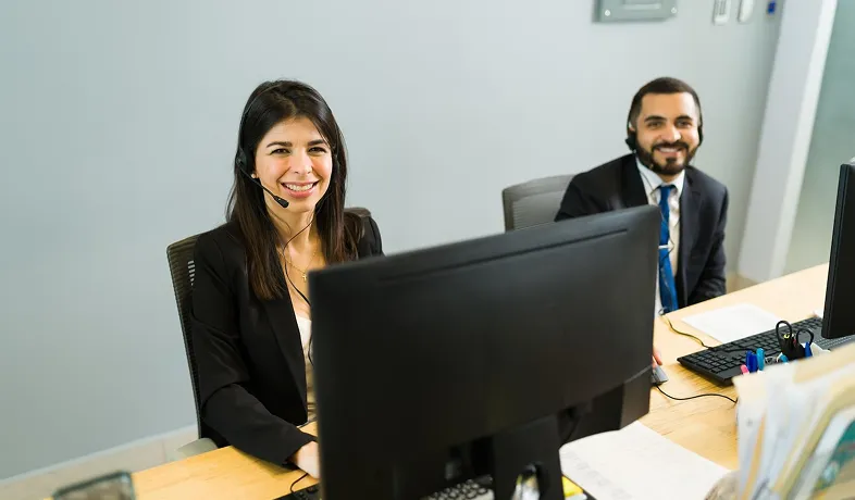 Office staff assisting clients