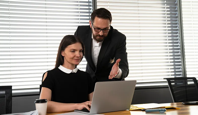 Two professionals collaborating on a project