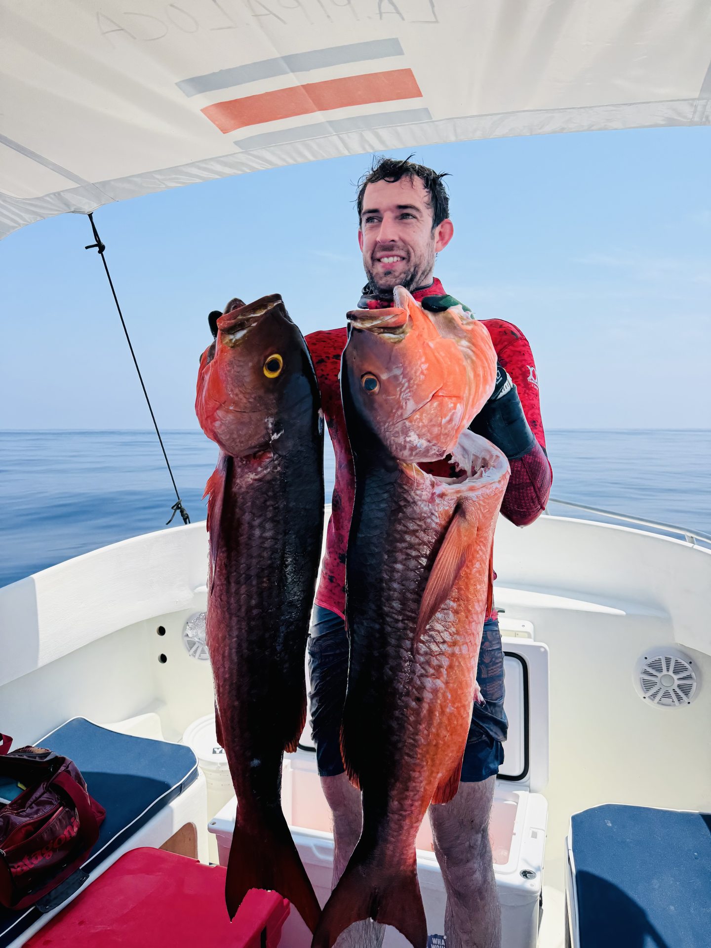 A guest holding catches after a trip