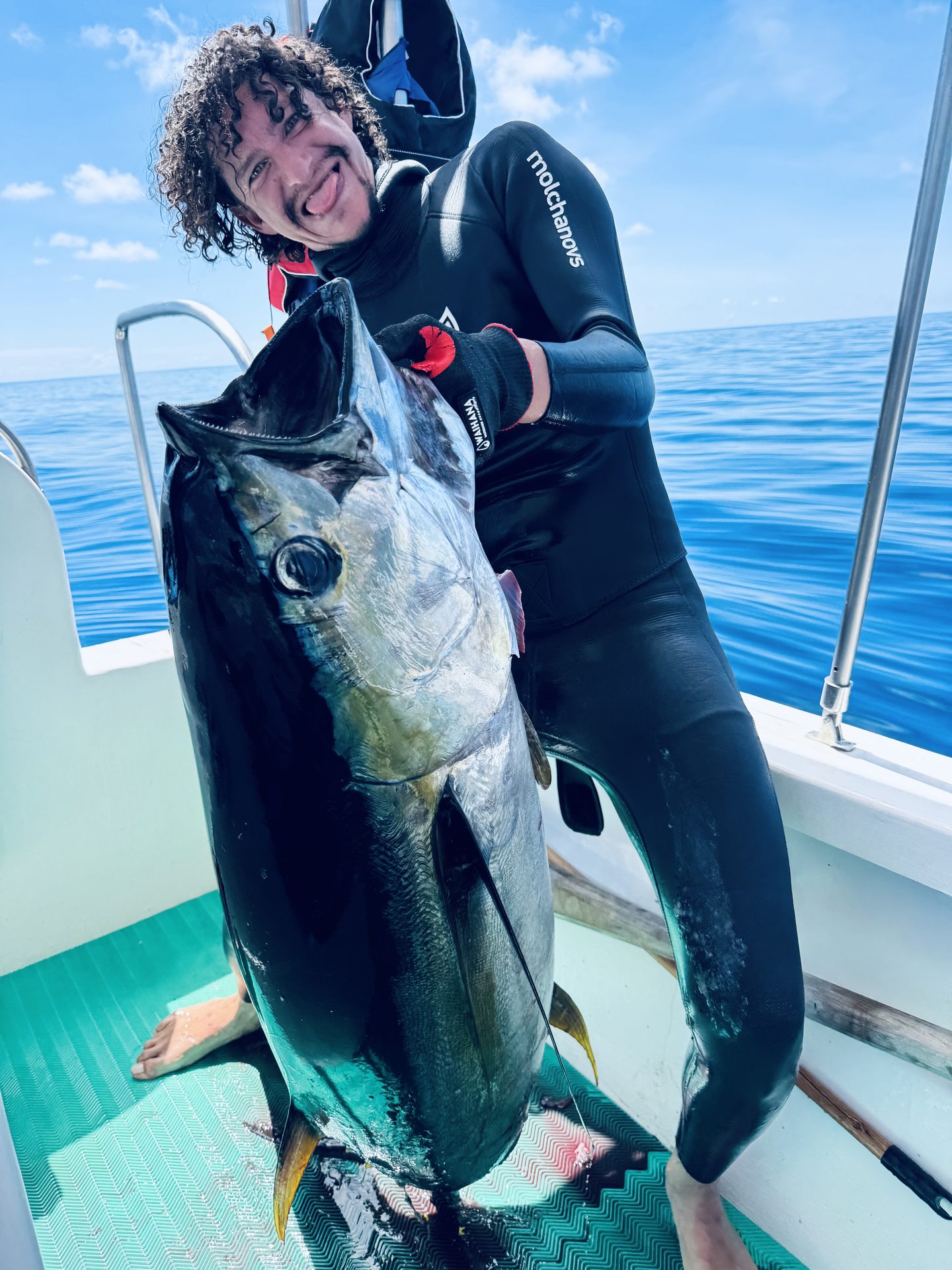 A spearfisher and tuna on the boat