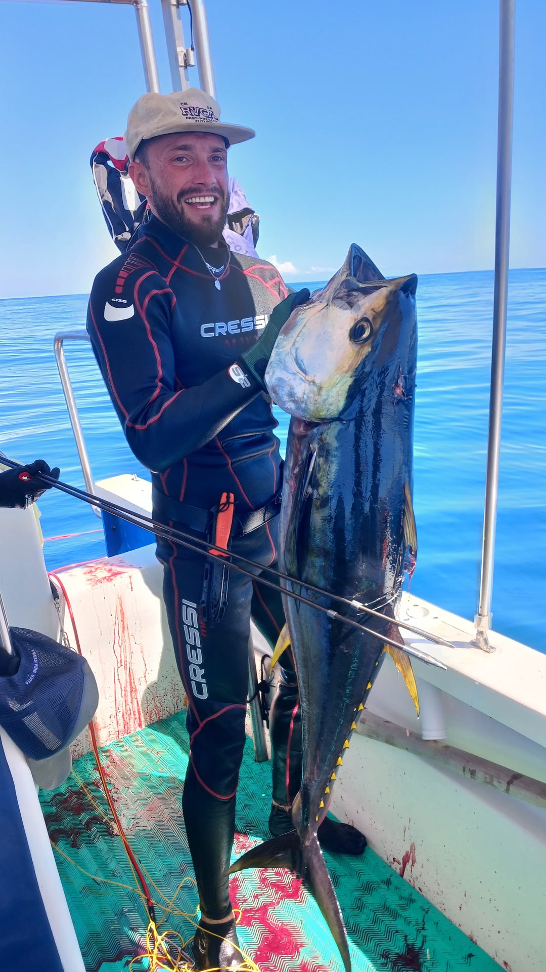A spearfisher with a catch aboard the boat