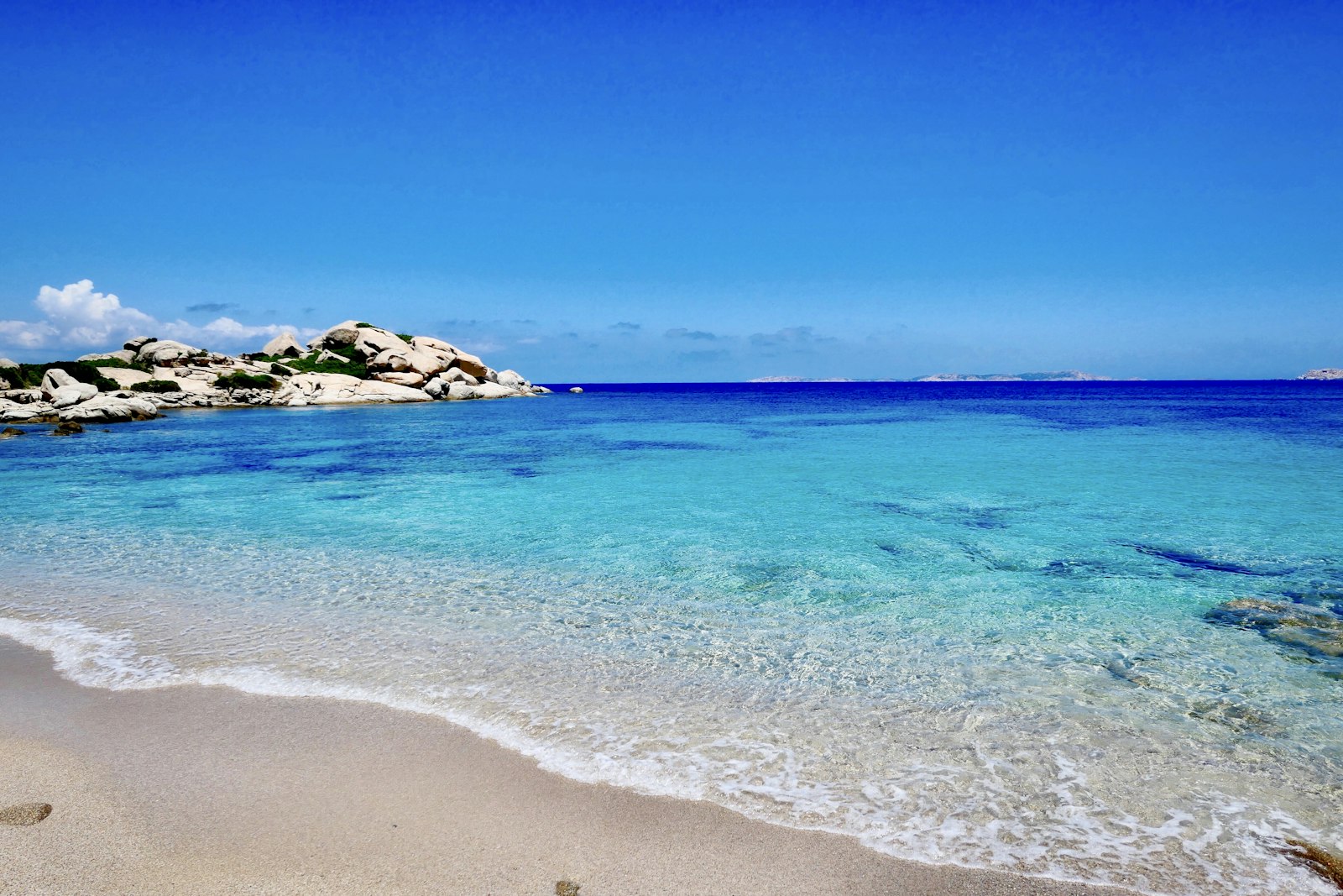 Turquoise sea against a rocky promontory at Valle dell'Erica, Sardinia