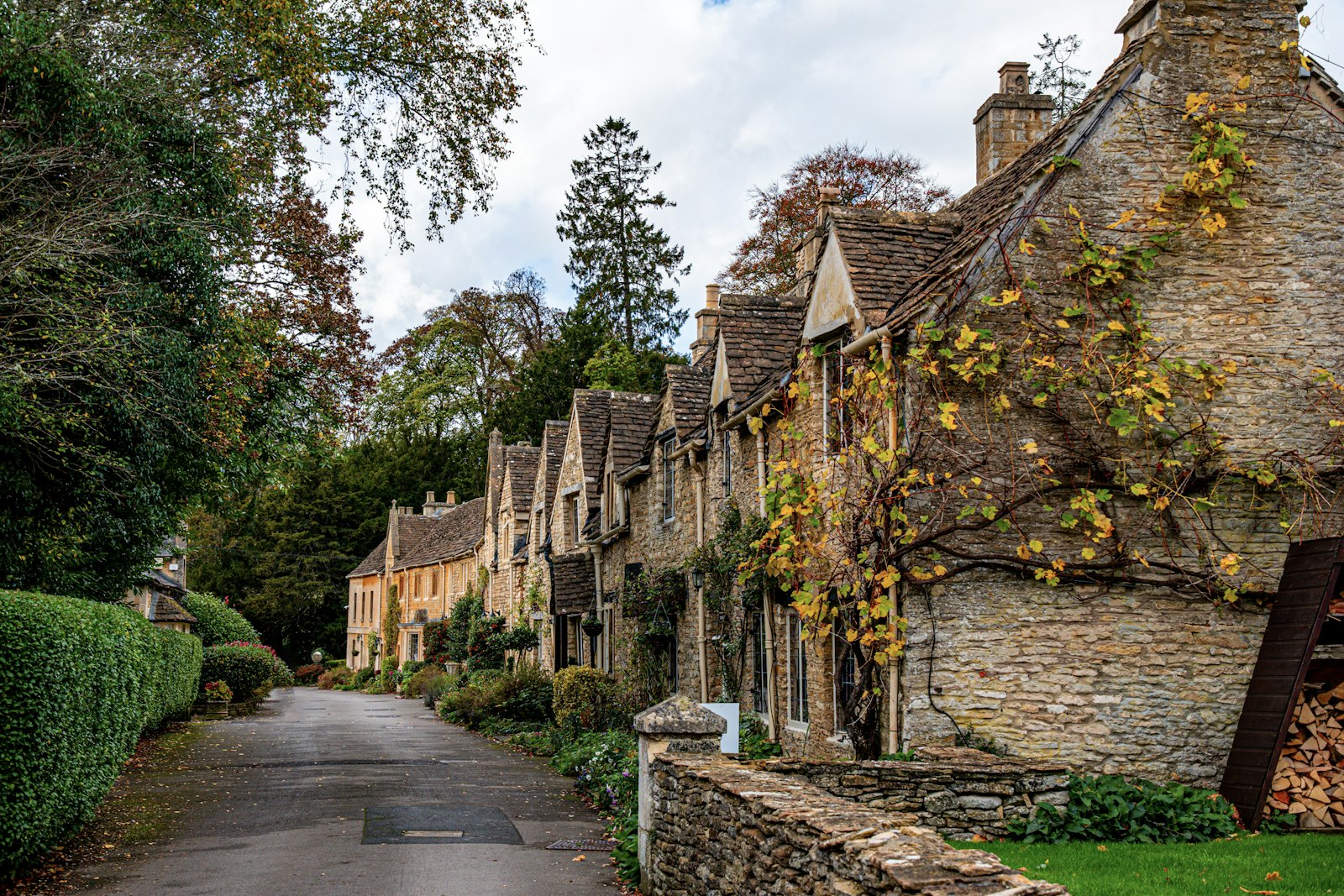 A street of honey-coloured stone cottages in Castle Combe, the Cotswolds
