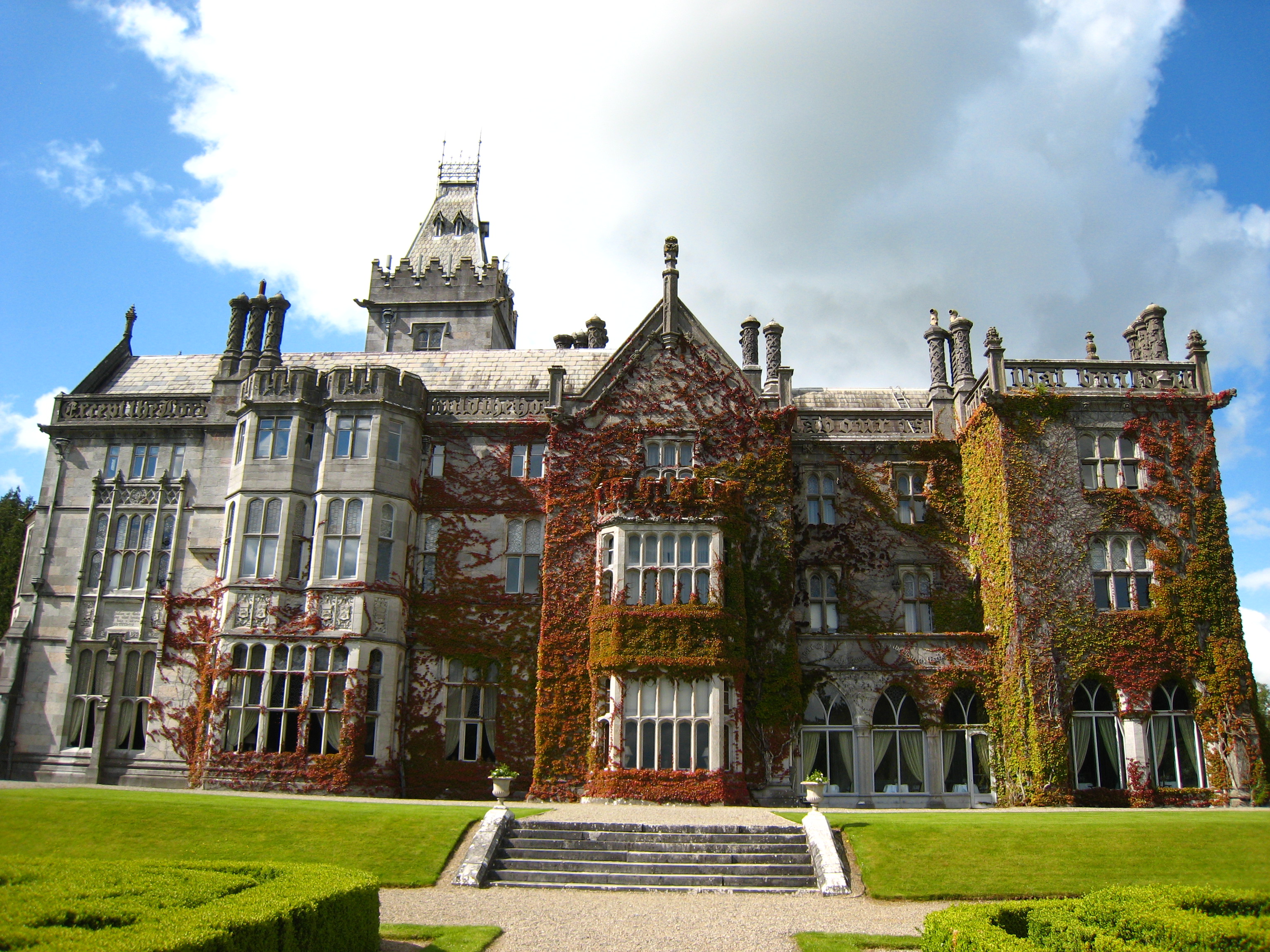 The ivy-clad Tudor-Revival facade of Adare Manor, County Limerick