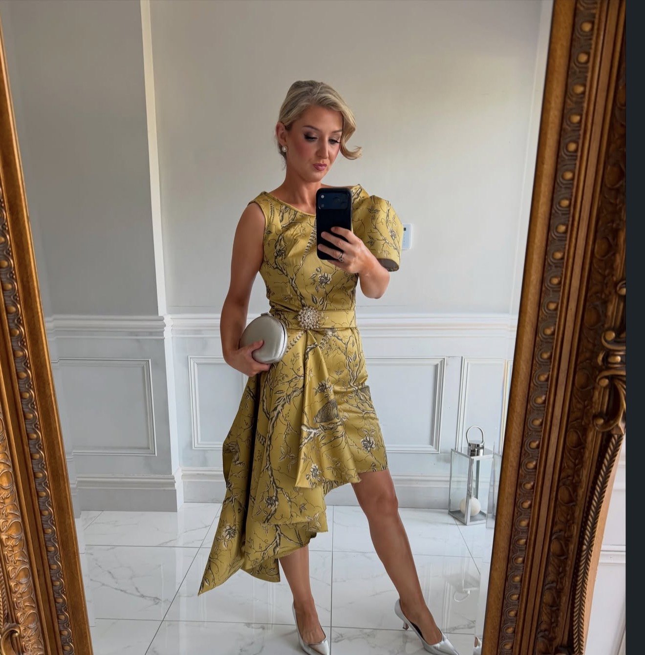 Dawn Knight photographing herself in the curtain dress before leaving for the races