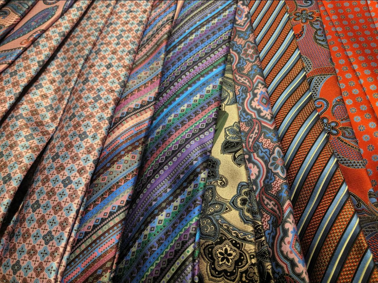 Patterned silk ties layered over one another
