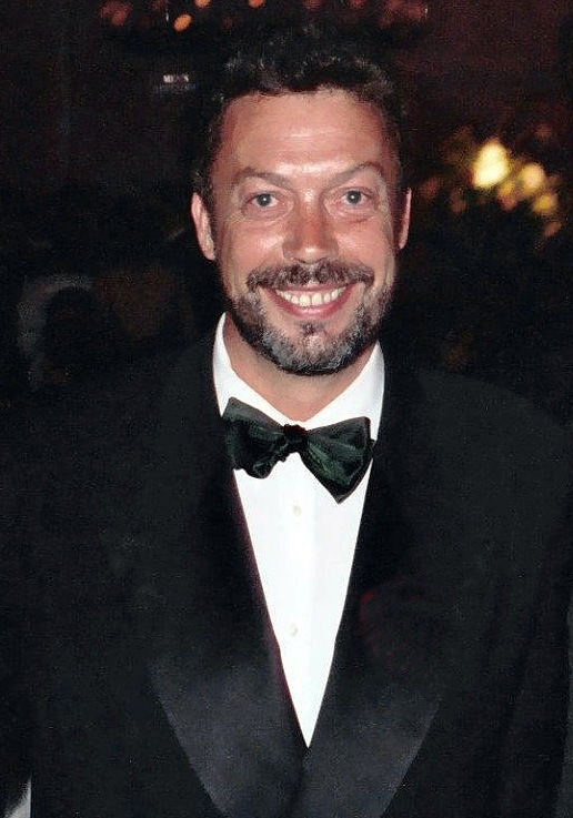 Tim Curry in black tie, smiling, photographed at the 47th Emmy Awards Governor’s Ball in September 1995.