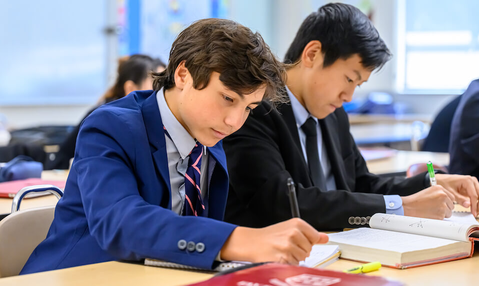 Two Fay School students working on a math problem.