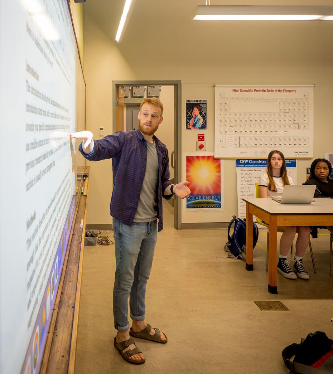 A CSW teacher using a smart board in his tutorial.