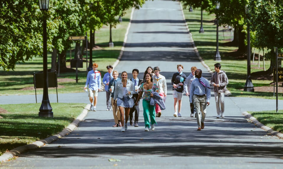 Episcopal High School students walking up the school's long driveway.