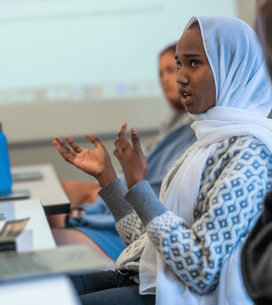 A Pomfret School student answering a question in class.