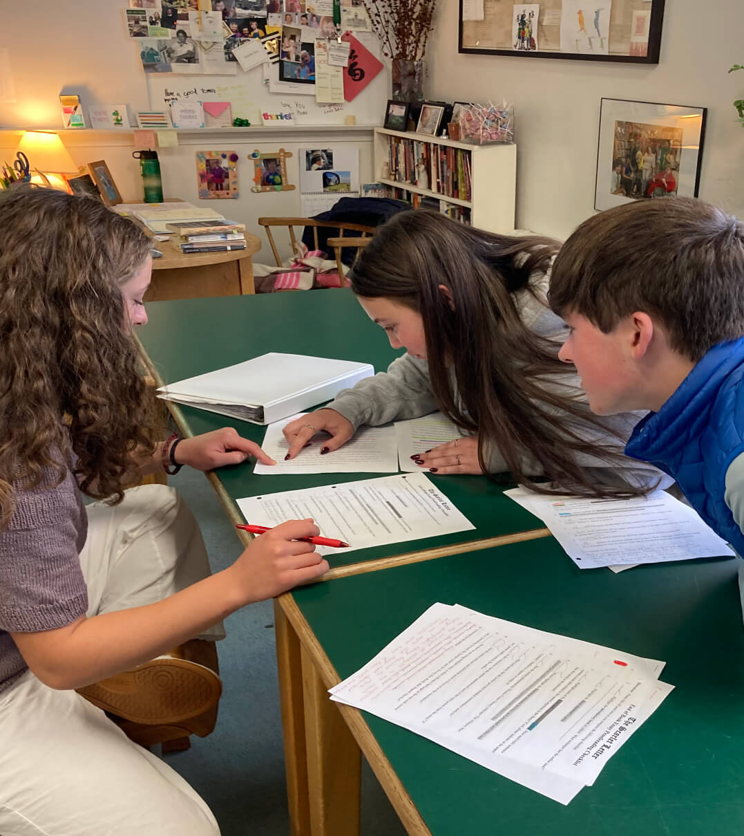 Hebron Academy students collaborating on a group project.