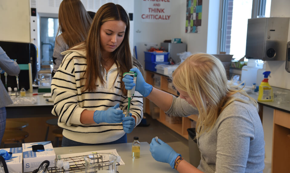 Two St. Mark's students conducting a science experiment.