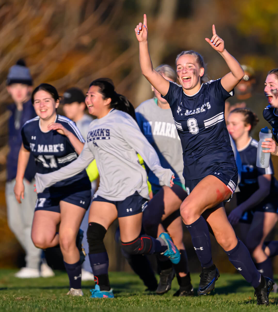 St. Mark's School girls' soccer team celebrating after a win.