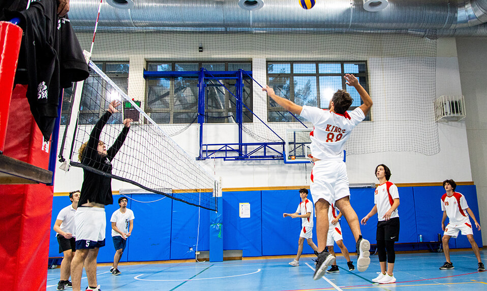 King's Academy students playing volleyball.