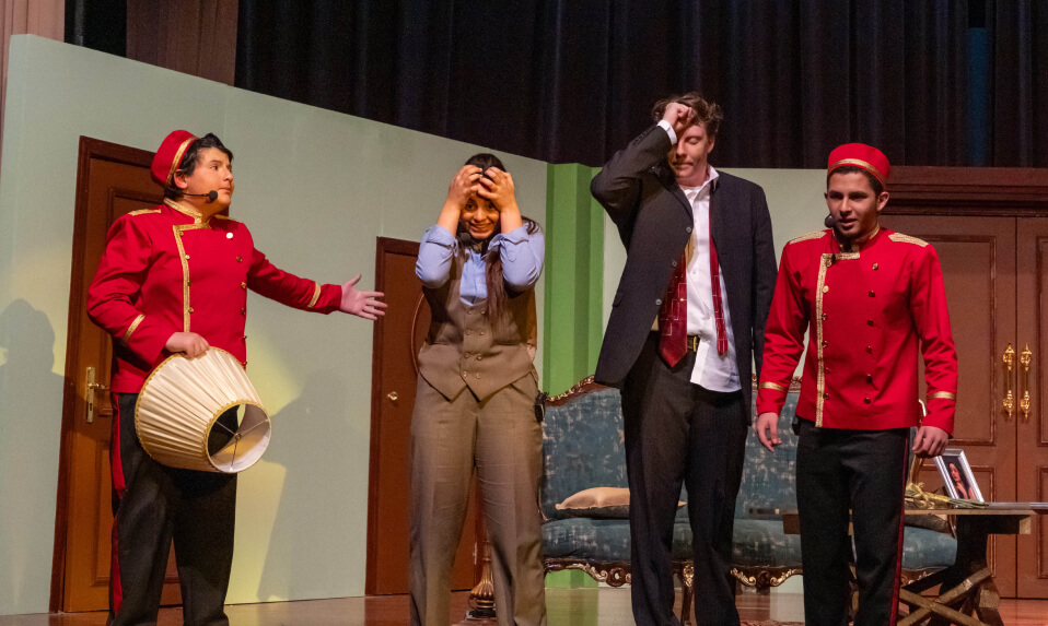 King's Academy students on stage performing in a school play.