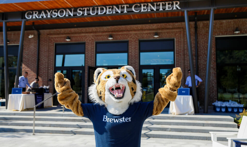 The Brewster tiger mascot celebrating outside of the Grayson Student Center.