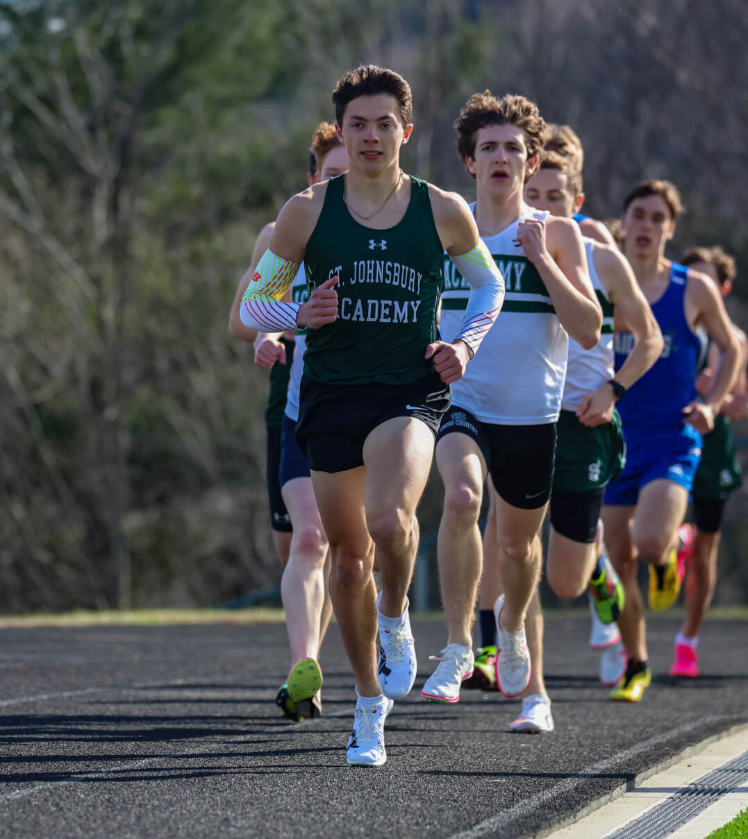 A St. Johnsbury Academy runner leading the pack in the mile race.
