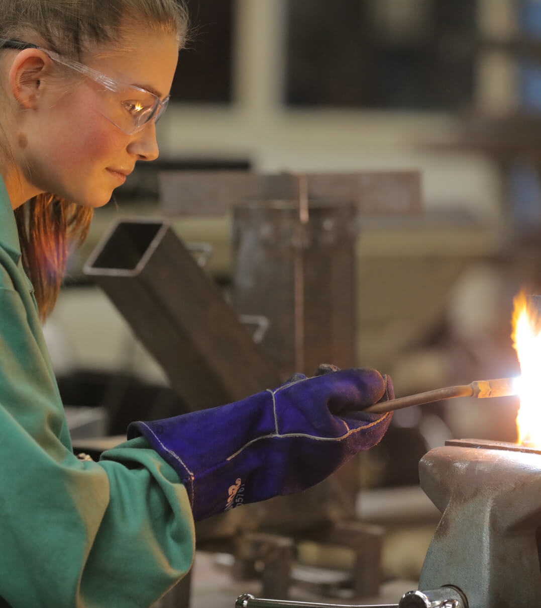 A St. Johnsbury Academy student wielding a torch.