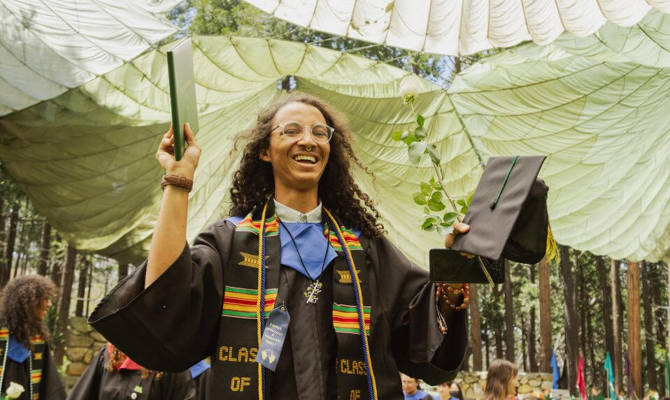 An Idyllwild PG student in a graduation cap and gown.