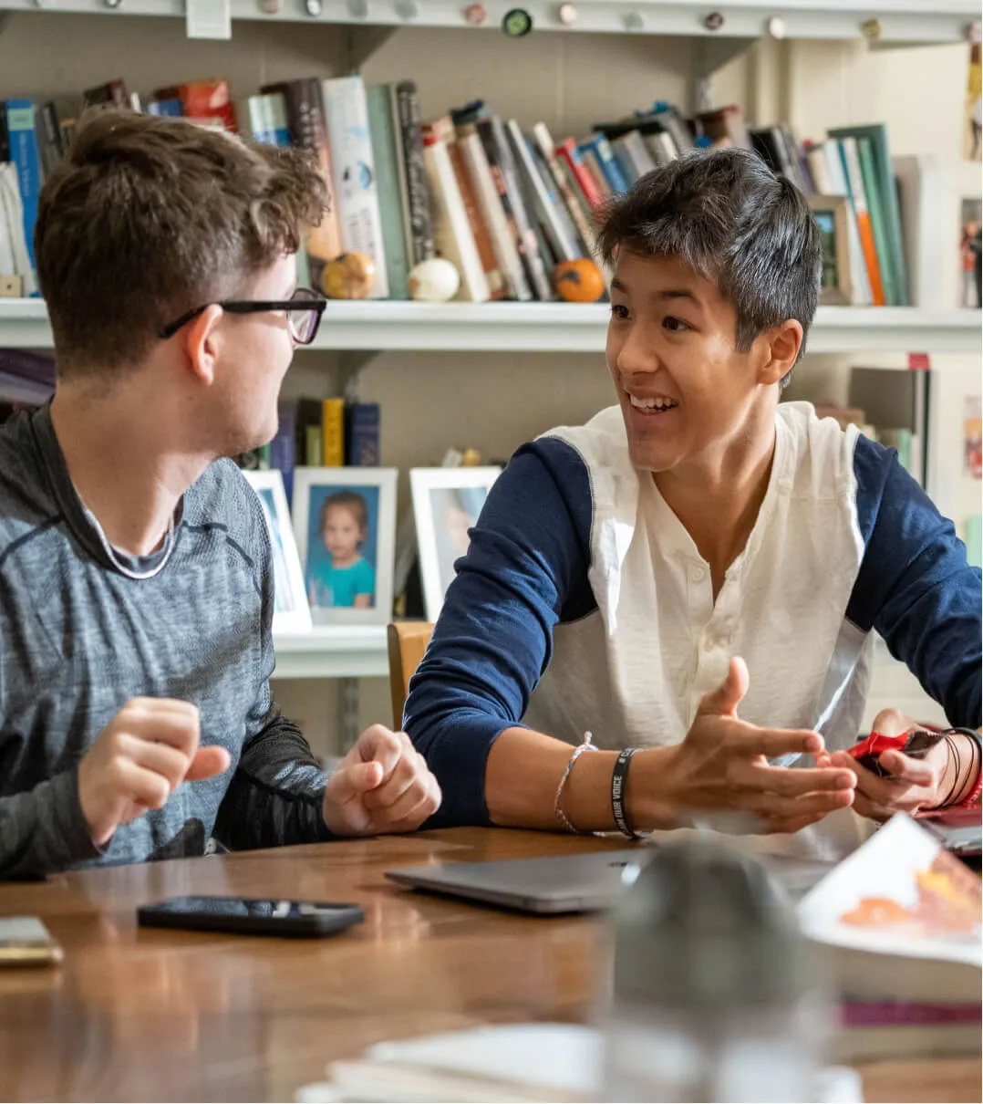 Two Middlesex School (MA) students excitedly working together in a class discussion.