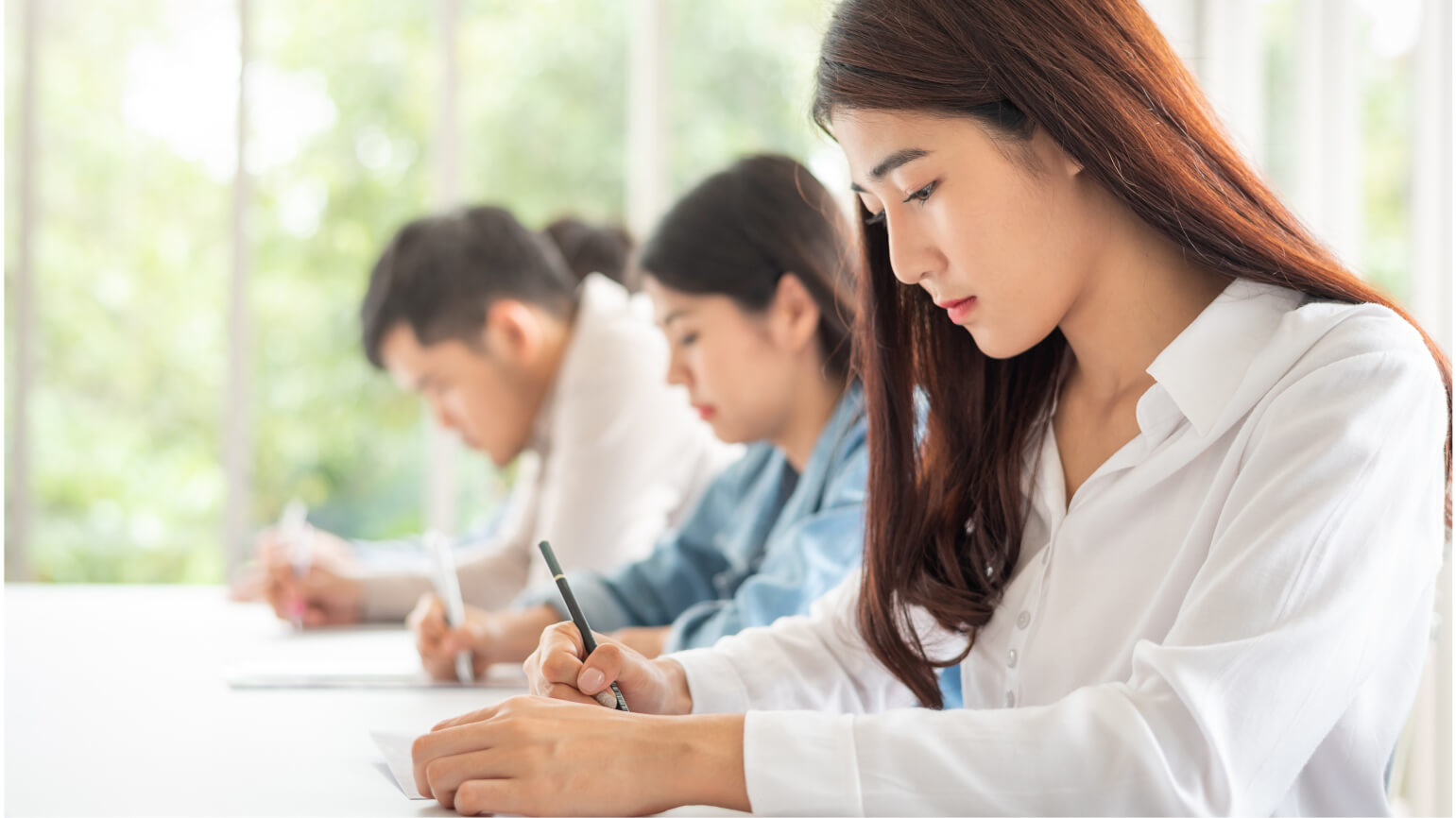 Students in a classroom taking the SSAT.