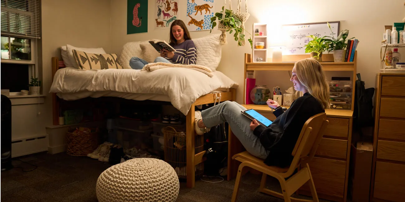 Two New Hampton School students studying in their dorm room.