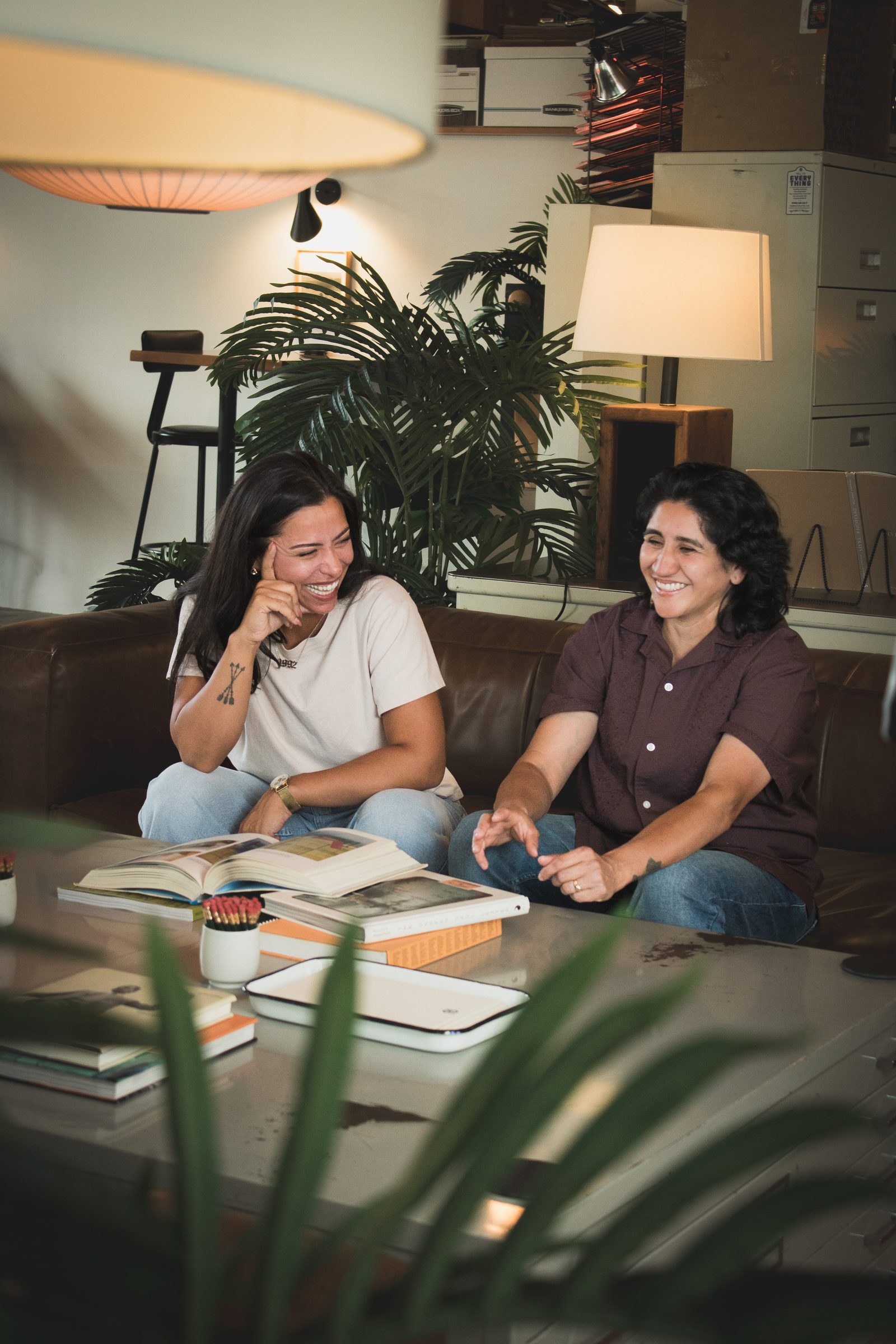 Two strategists working over printed materials in the studio