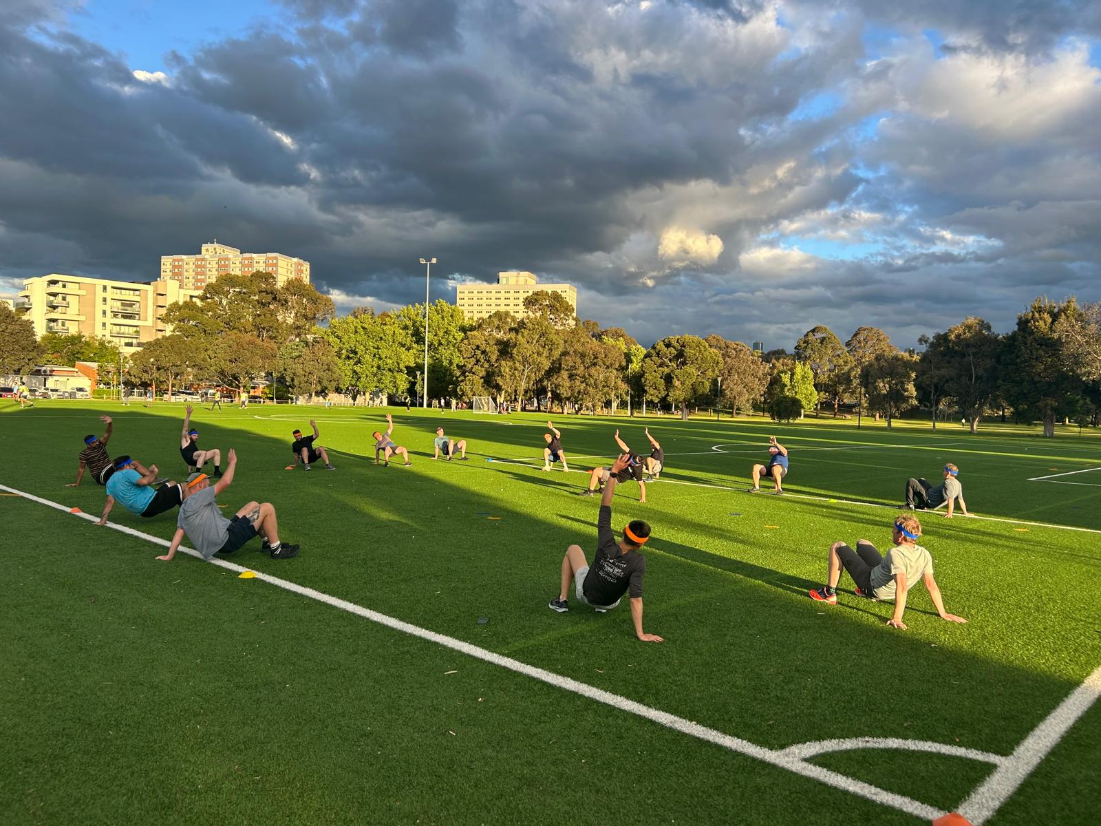 Dads warming up at an outdoor Dadfit session