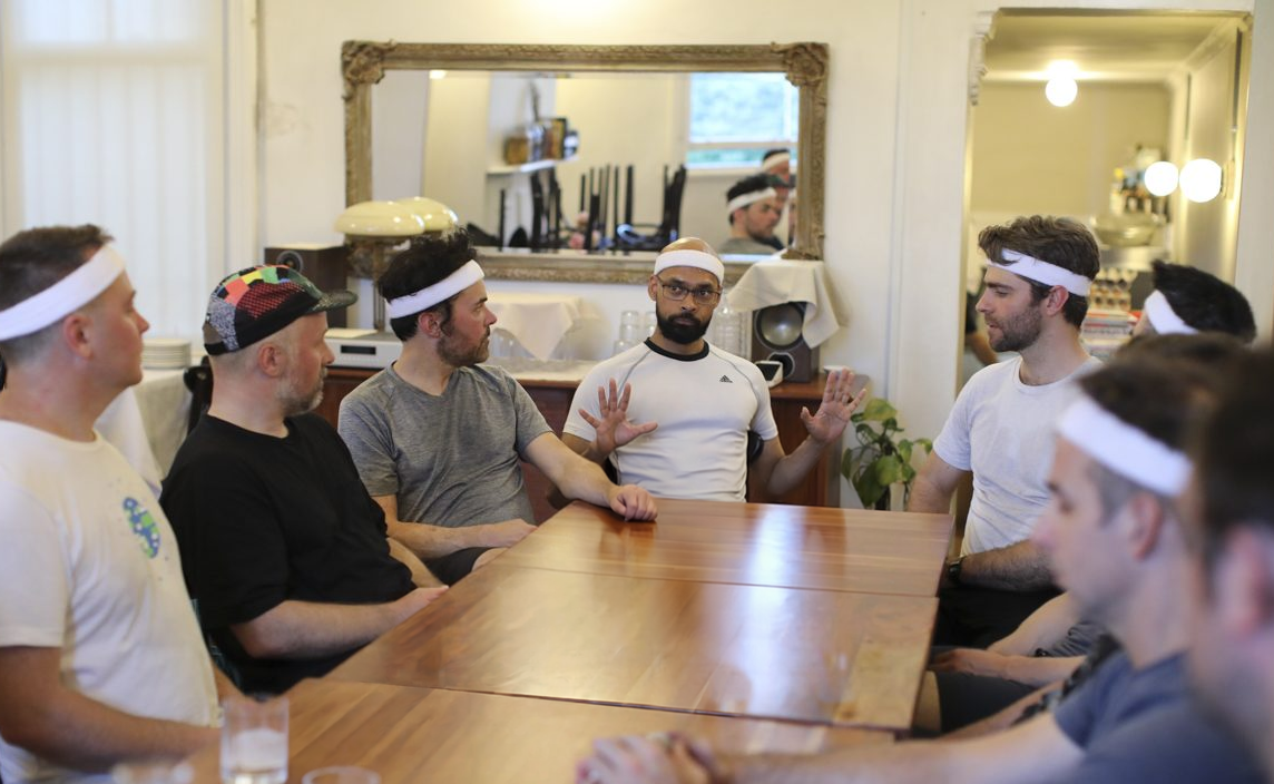 Dads sitting around a table during a Dadfit dad chat